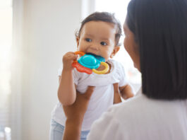 Shot of a mother bonding with her baby daughter at home